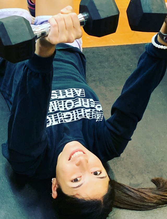 Dumbbell bench pressing on the floor