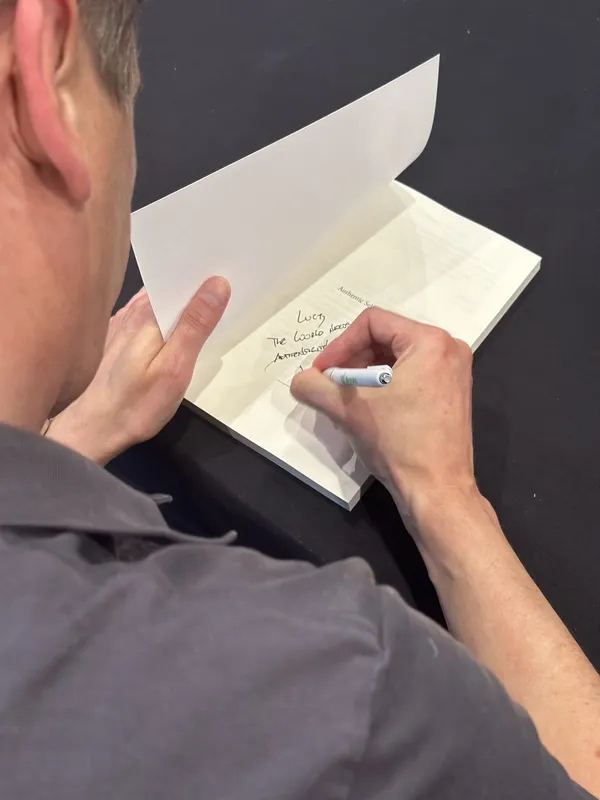 Peter writing a personal inscription