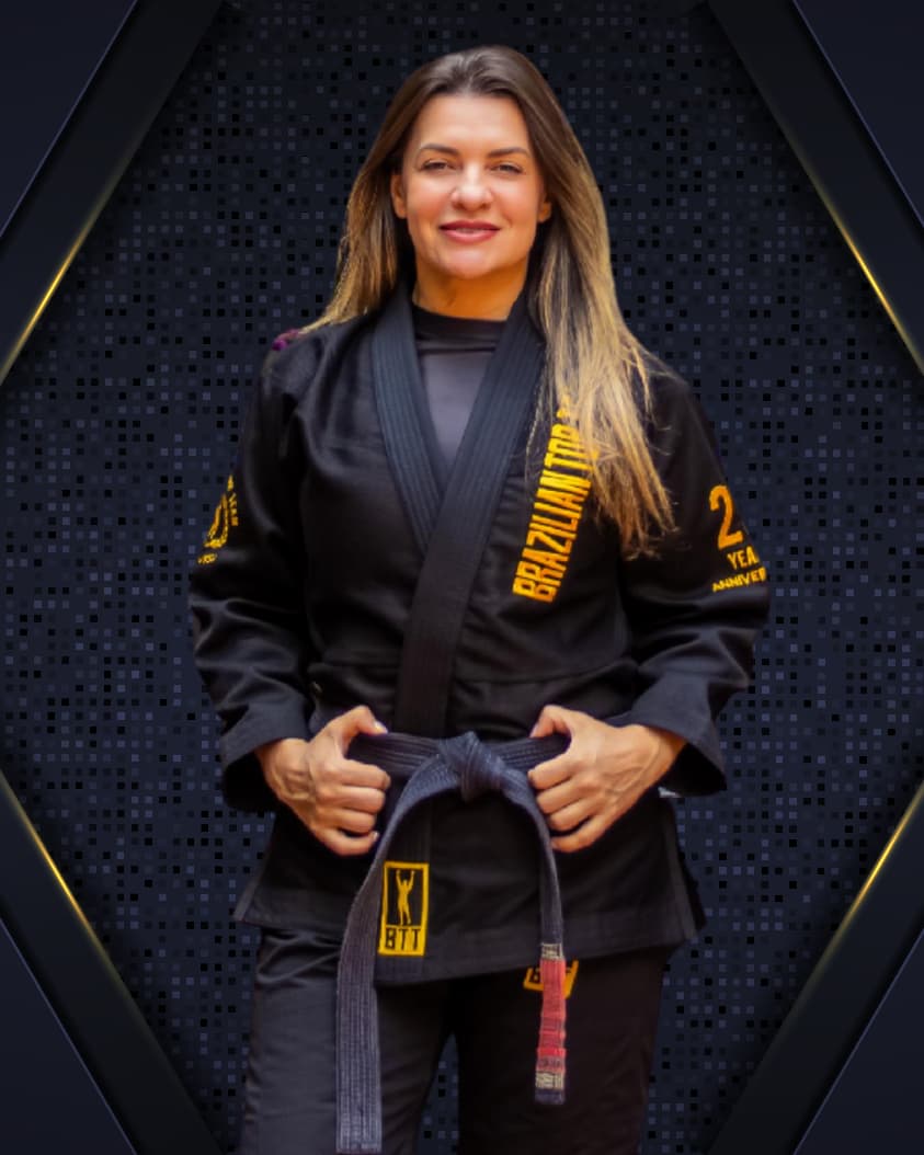 Prof. Denise Gamonal in her black BTT gi