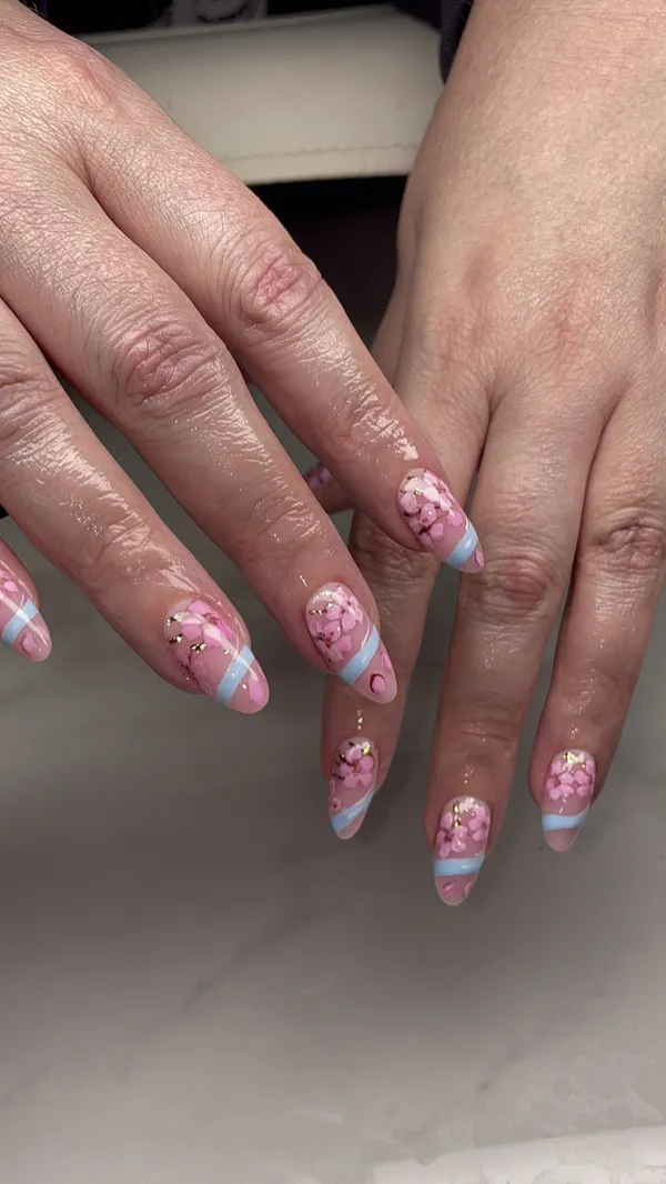 Pink and blue almond nails with floral nail art