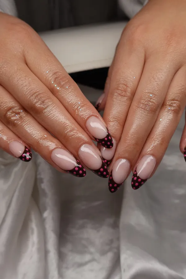 Burgundy polka dot French tip almond nails