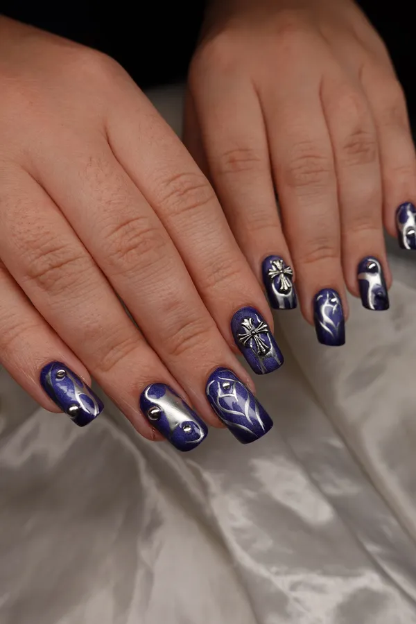 Navy chrome nails with star accents