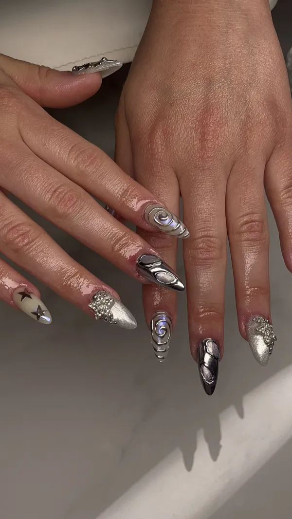 Silver chrome and black accent almond nails