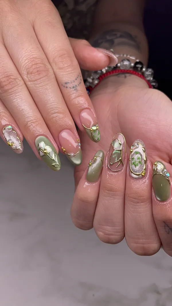 Sage green and chrome accent almond nails