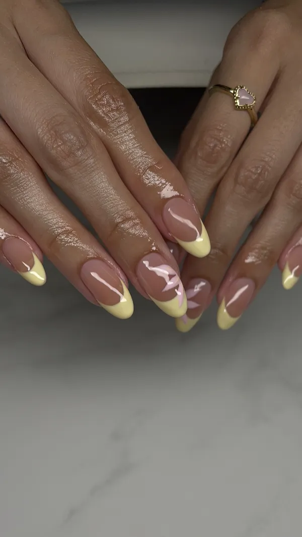 Almond nails with yellow French tips