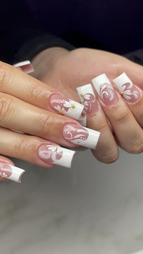 White French tip square nails with pink floral swirl art