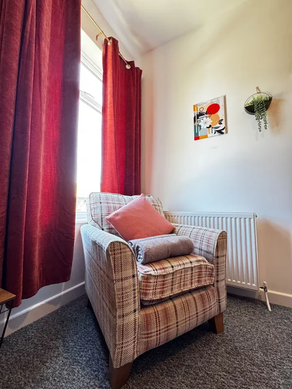 Wicker armchair by the window at the Worsbrough home
