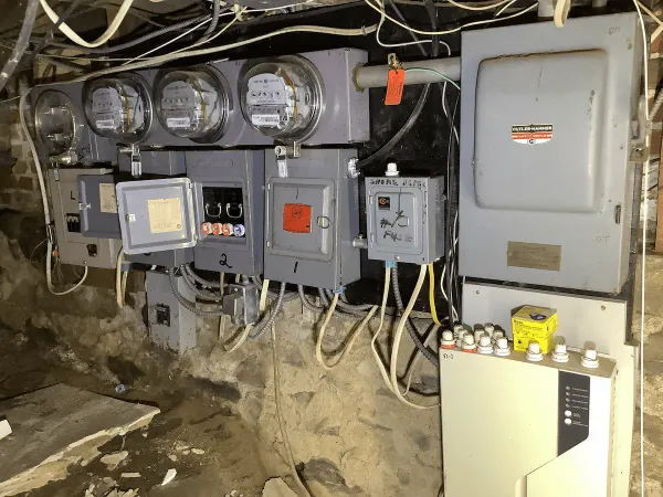 Before: existing indoor meter equipment and electrical panels