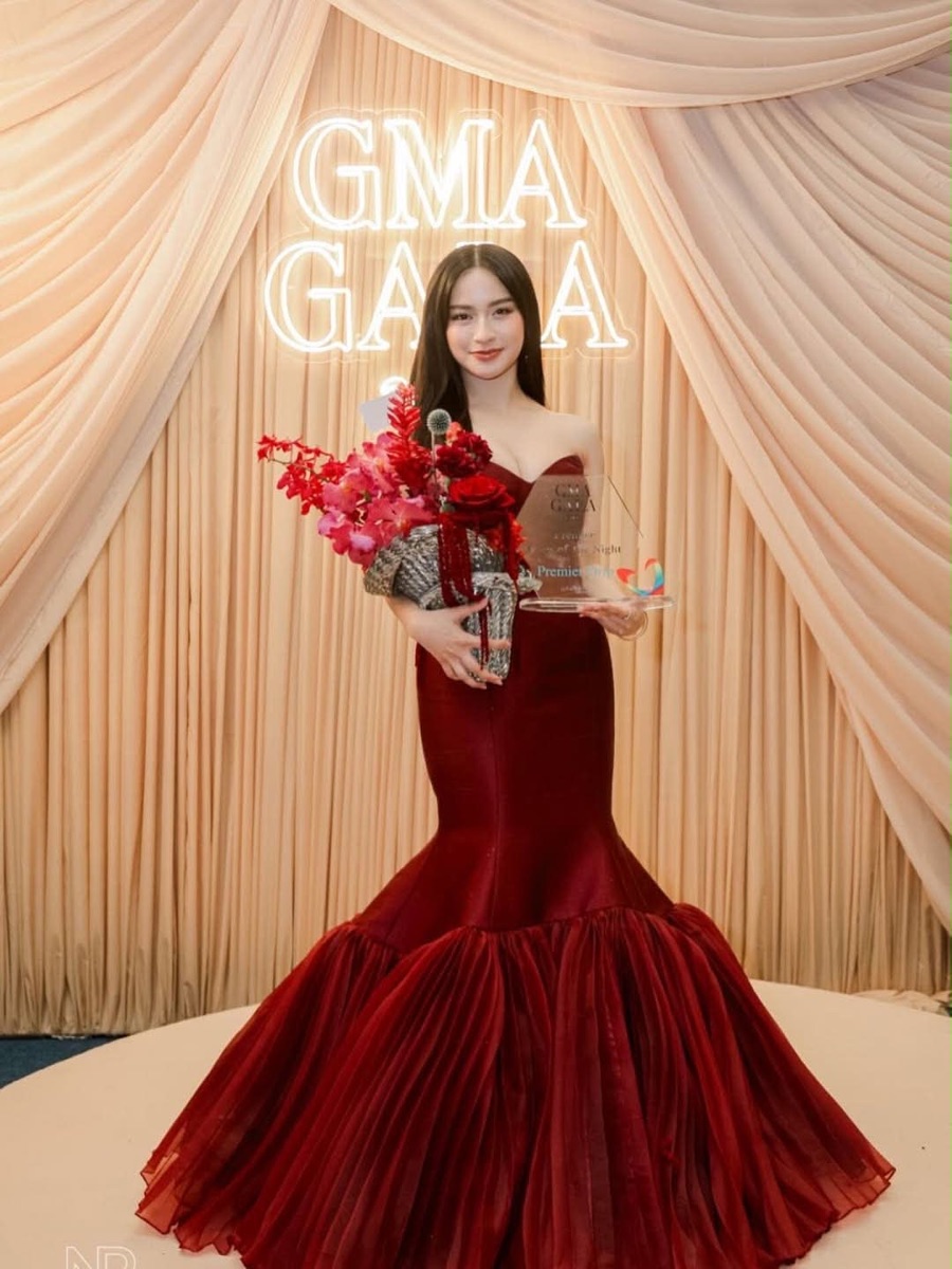 A deep wine mermaid gown at a gala