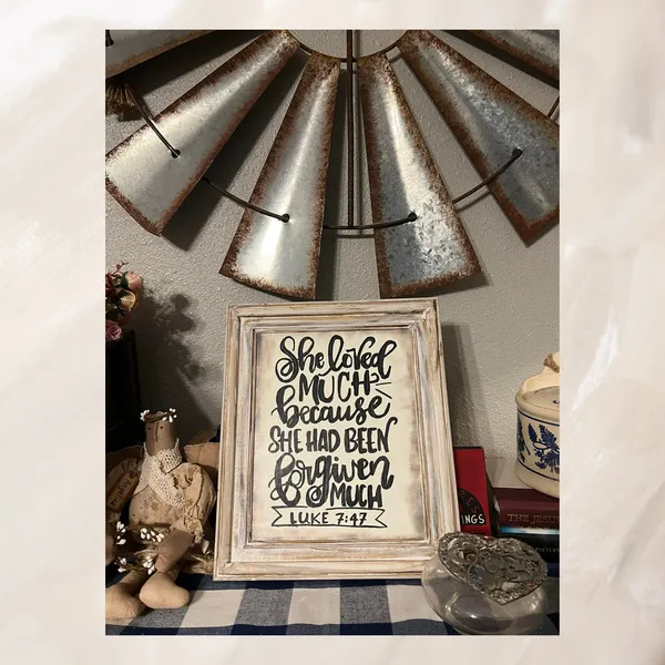 Student's hand lettered sign styled on a shelf