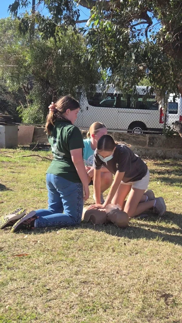 First aid trainer coaching a student through a scenario
