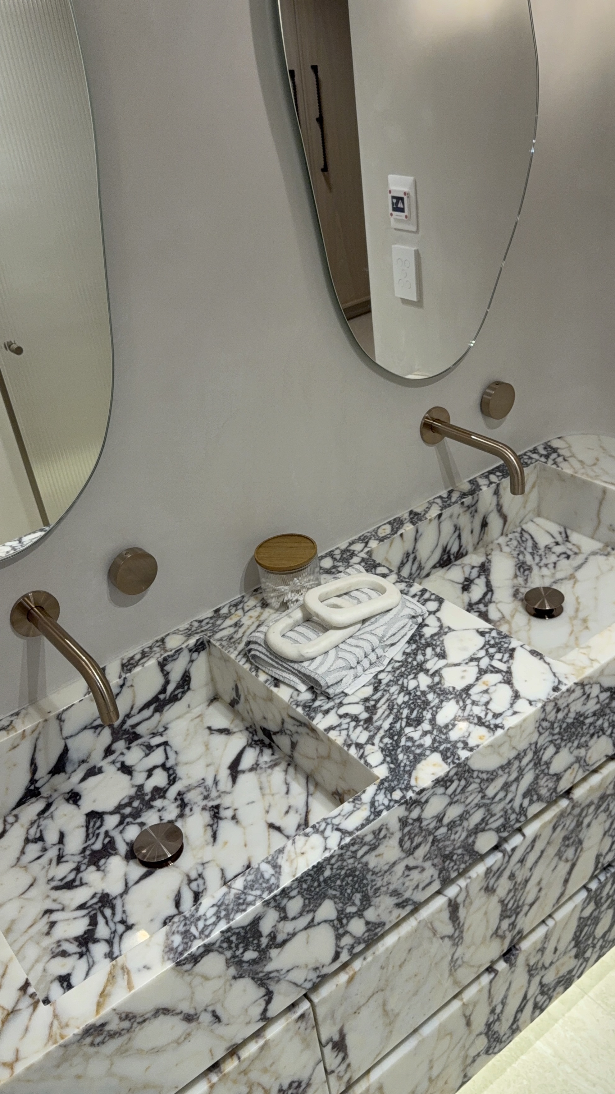 Marble vanity with brass tapware