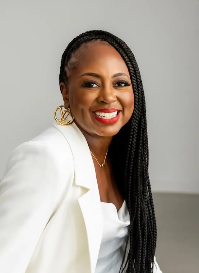 Natarsha Wright wearing a white blazer