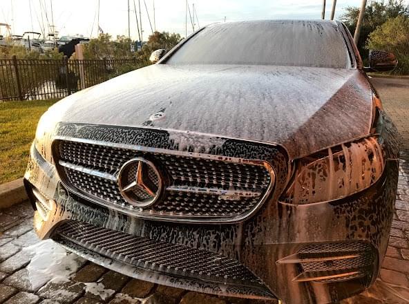 Mercedes covered in foam during a mobile foam wash by Invictus in Omaha NE