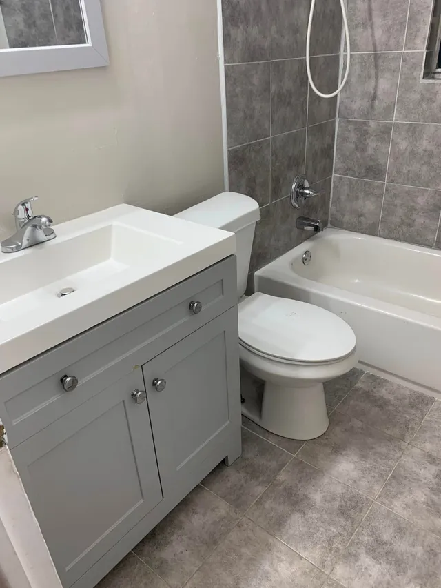 Vanity, toilet and tub in a bathroom cleaned by Pretty in Pink Cleaning Service near Montgomery, AL