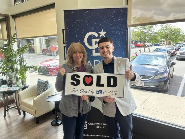 Brenden Gutbrod with a client at a closing