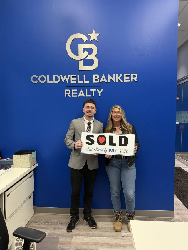 Brenden Gutbrod with clients at a closing