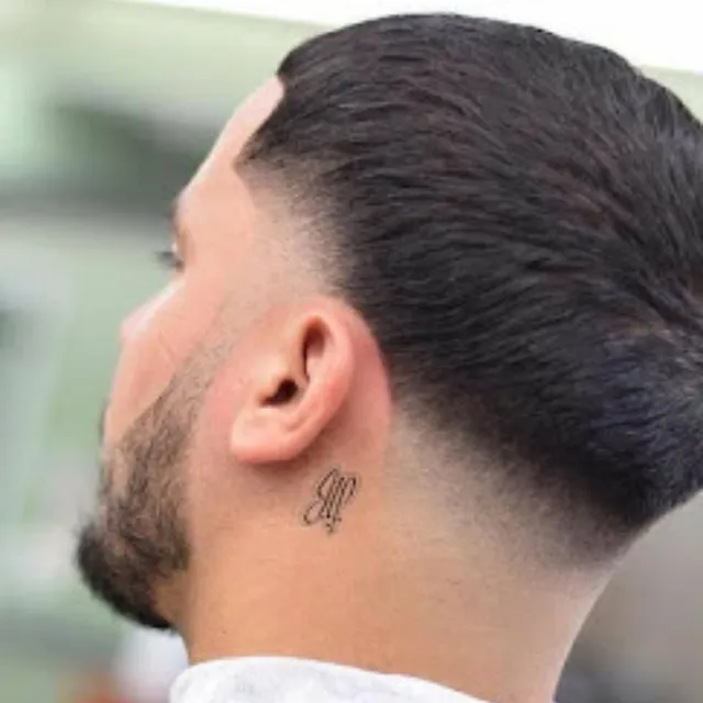 Clean low taper fade at Salon Salman Pierrefonds