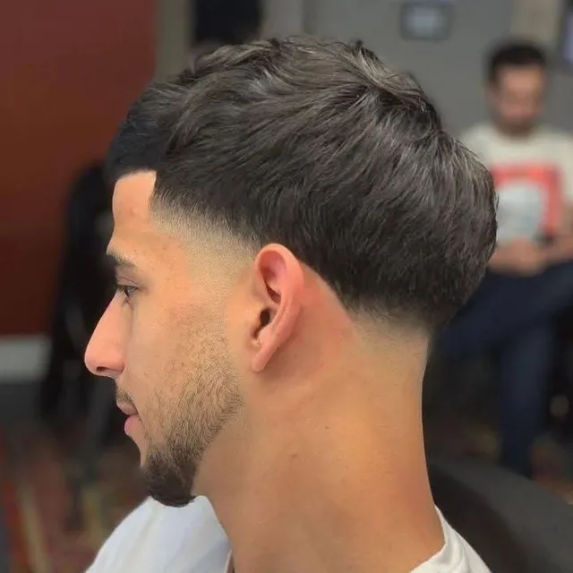 Textured crop with taper fade at Salon Salman