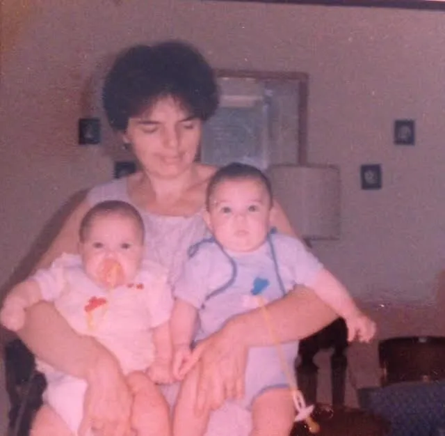 Giovanni as a baby with his mom and twin sister