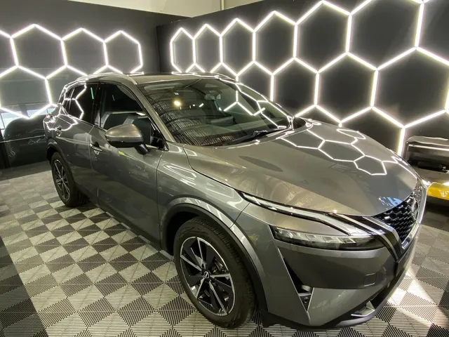 A nissan qashqai is parked in a showroom - window tinting by Tint Wright Brisbane