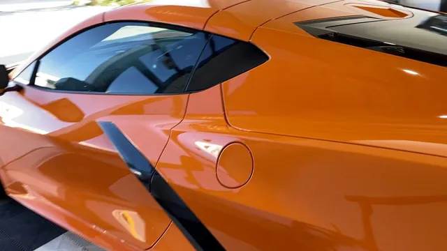 A close up of the side of an orange sports car - window tinting by Tint Wright Brisbane