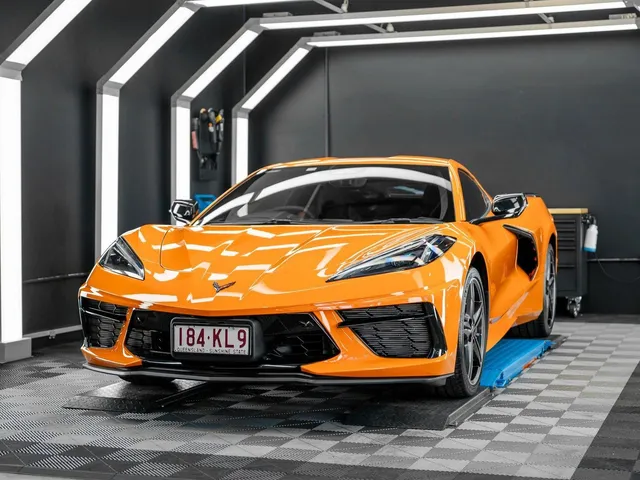 An orange sports car is parked in a garage - window tinting by Tint Wright Brisbane