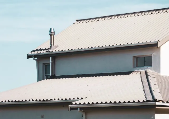 Two-story home with a light-colored metal roof