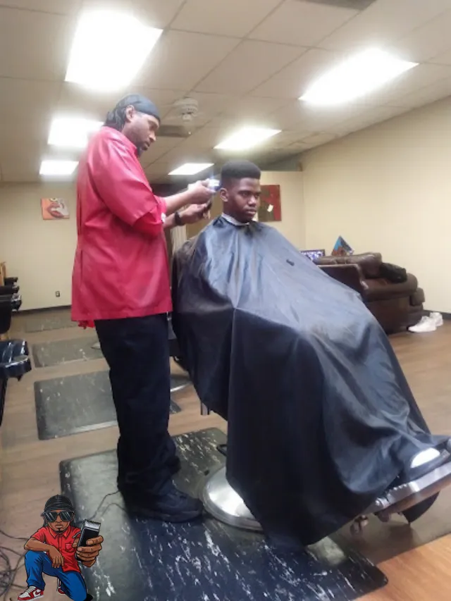 Barber at work with a client on the shop floor