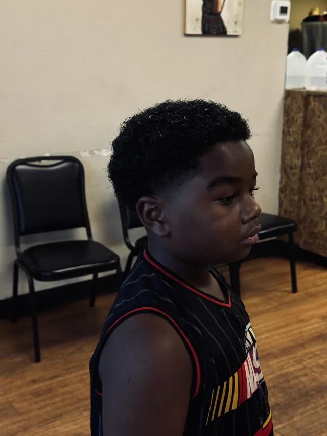 Young client after a fresh cut at the shop
