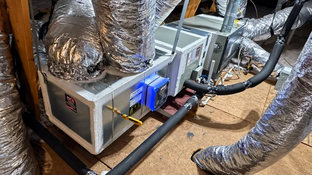 Attic HVAC system with illuminated air-quality equipment