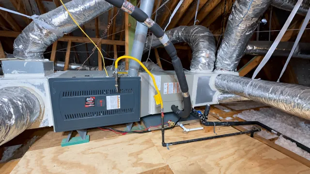 Attic furnace and duct system with connected gas and refrigerant lines