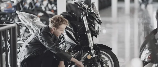 A man looking at motorcycles