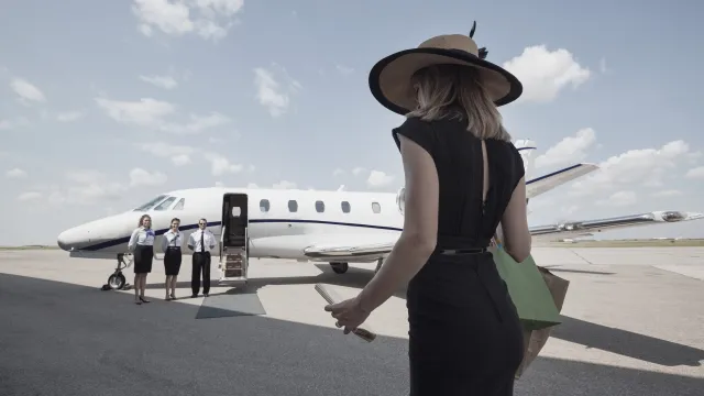 A traveler approaching a private aircraft