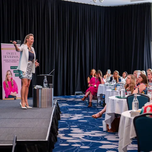 Sarah Cordiner presenting to a seated audience
