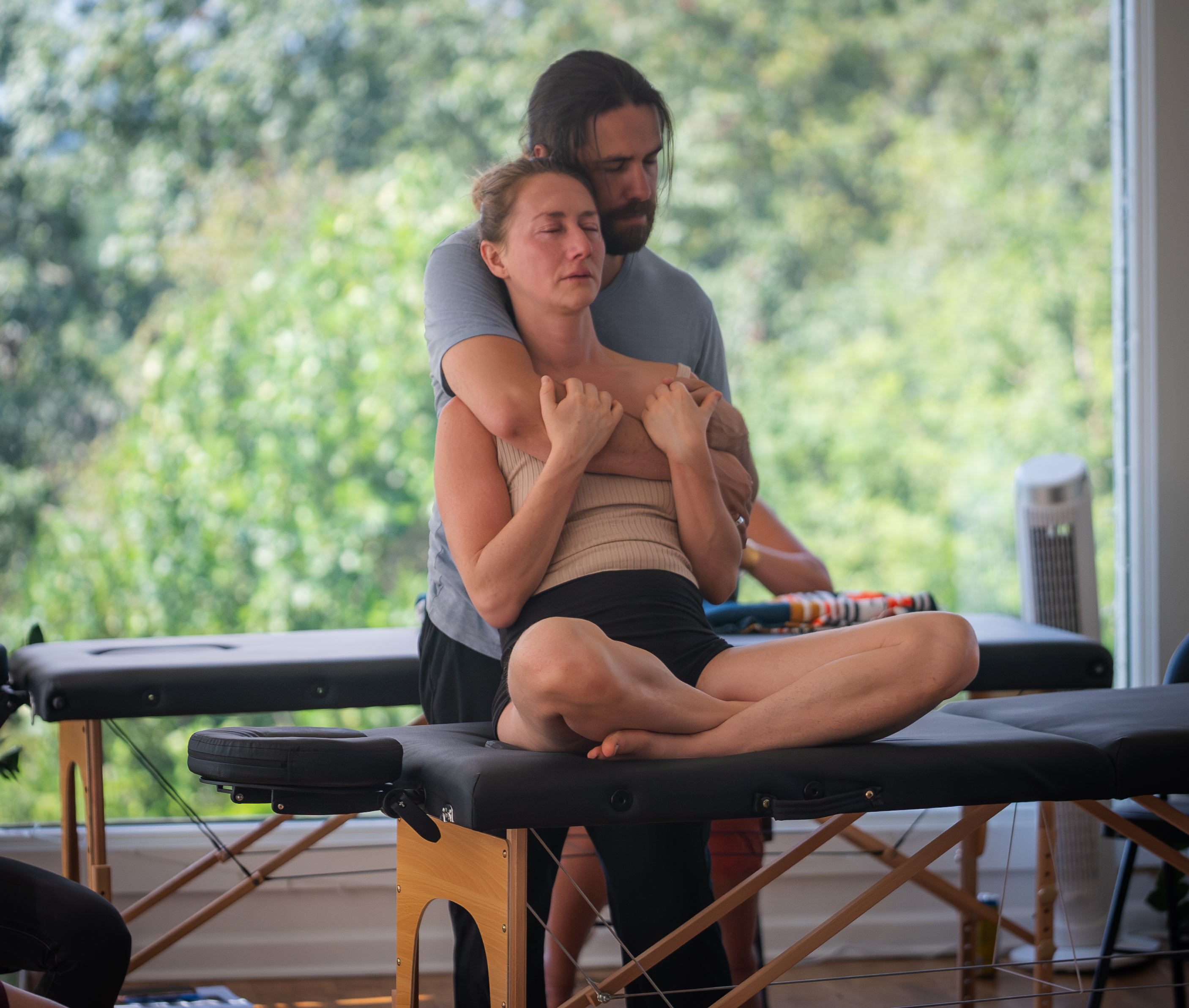 An authentic moment of somatic release — held in the training room