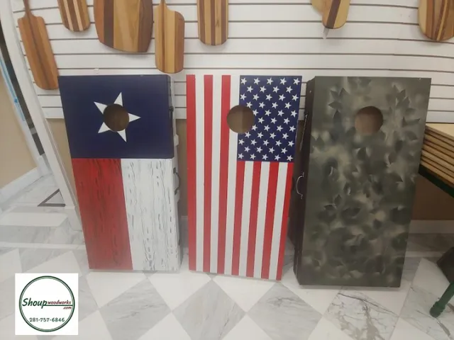Custom cornhole boards painted with the Texas flag, American flag and camouflage by Shoup Woodworks in Houston