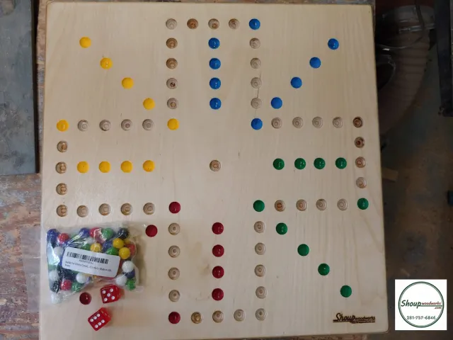 Four-player wooden Wahoo board with colored holes, marbles and dice, handmade in Houston by Shoup Woodworks