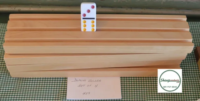 Stack of handmade wooden domino racks by Shoup Woodworks in Houston