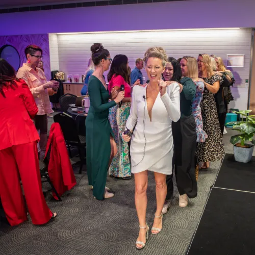 Sarah Cordiner dancing with attendees at an event