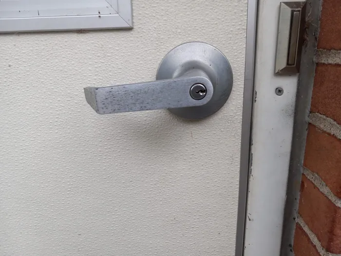Commercial lever lock on a metal door