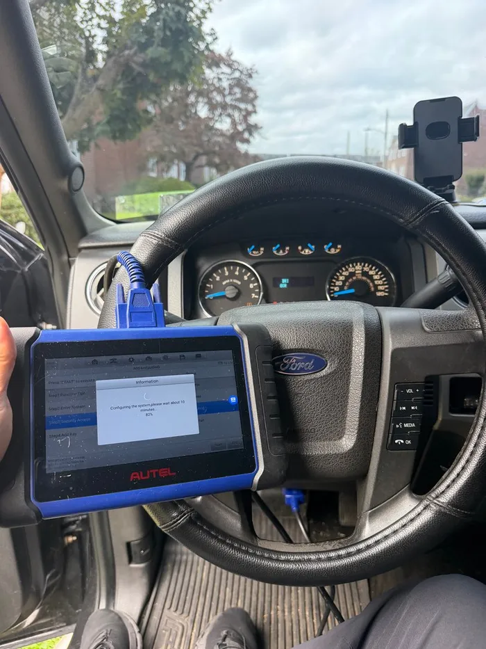 Key programming tablet connected inside a pickup truck