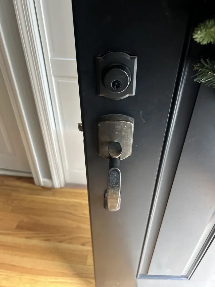 Deadbolt and handle installed on a door