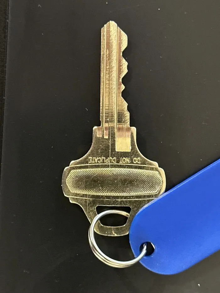 Copied house key on a key tag