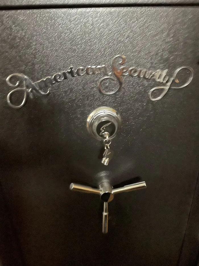 Gun safe with a combination dial and handle