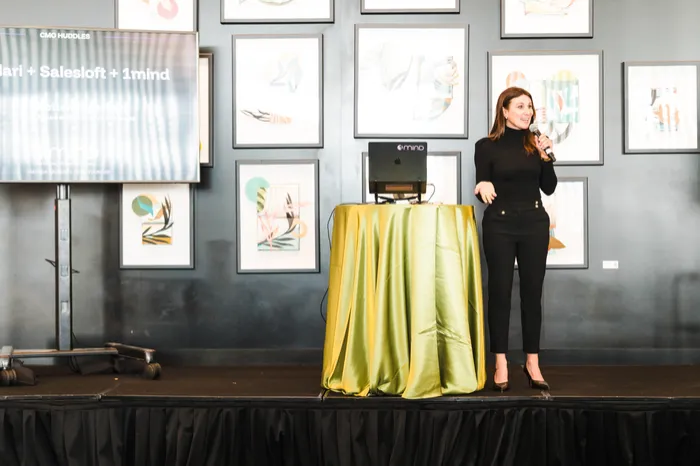 A speaker on a gallery-style stage