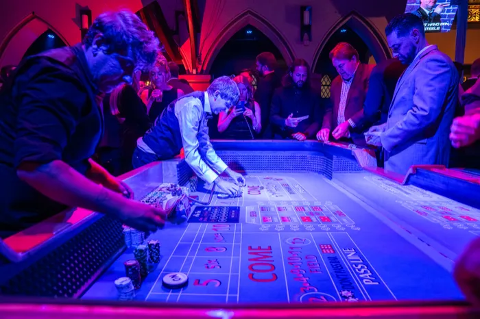 Guests at a casino table during an evening event
