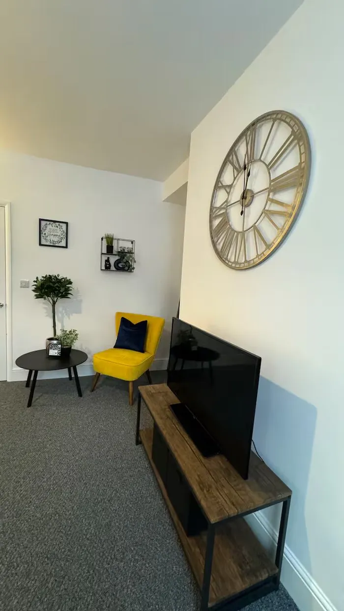 Kitchen with light wood units and washing machine at the Barnsley town centre home