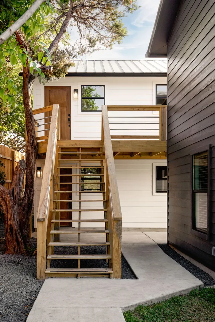 New wood stairs up to a second-story entry