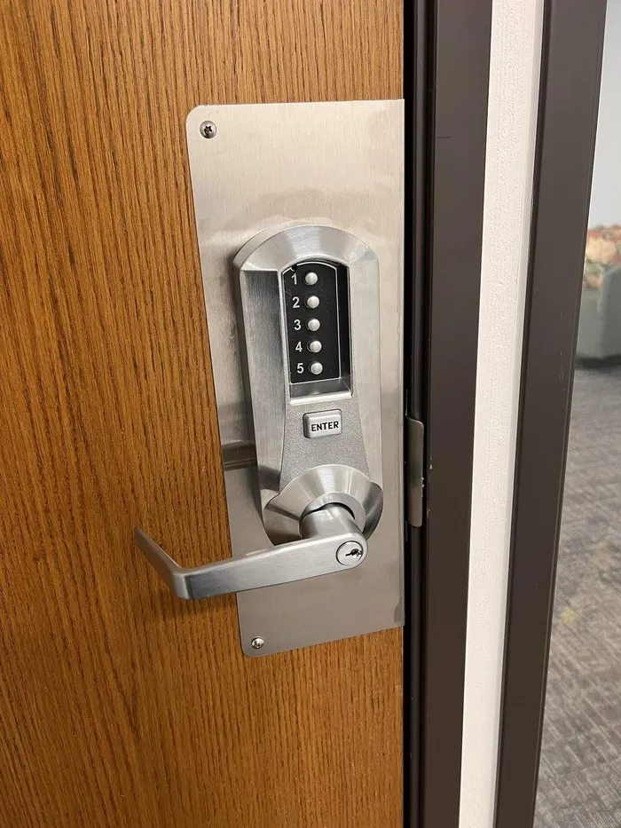 Mechanical pushbutton keyless lever lock on a wood door